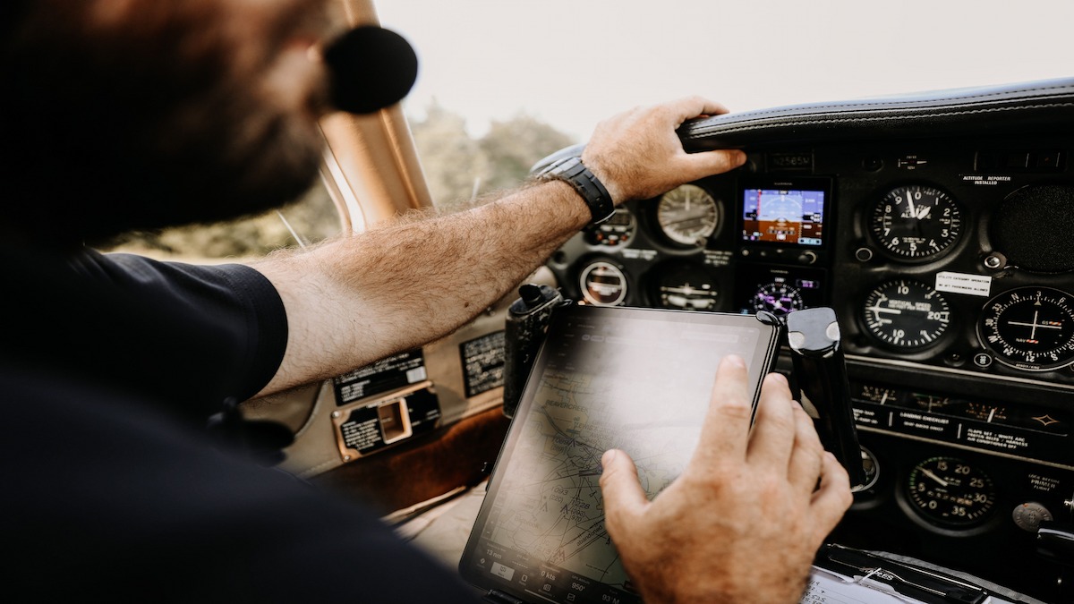 Digital pilot logbook displayed on a tablet in a cockpit